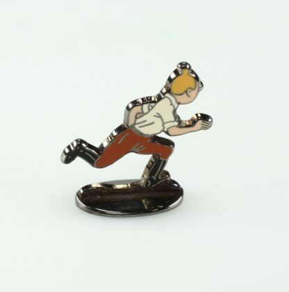 Tintin courant au Congo (bas relief) + boite Figurine en métal