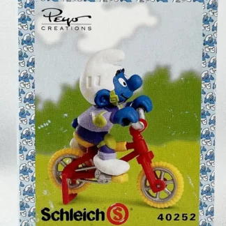Les Schtroumpfs Figurine en pvc Schtroumpf à vélo acrobatique + boite-emballage
