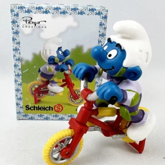 Les Schtroumpfs Figurine en pvc Schtroumpf à vélo acrobatique + boite