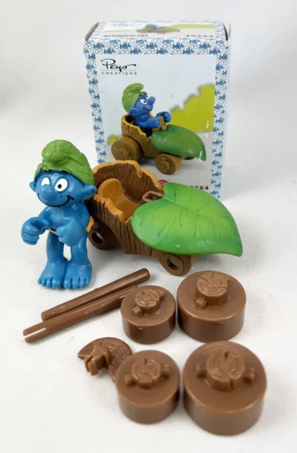 Les Schtroumpfs Figurine en pvc Schtroumpf en voiture feuille + boite